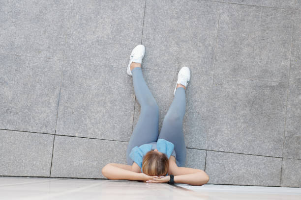 istock Sportwoman resting after training 1309699871