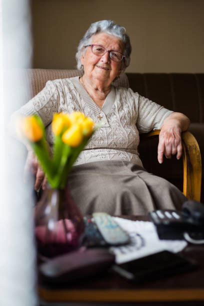 istock Lovely mature lady resting at home 1309701102