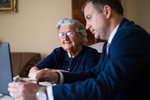 istock Real-estate agent showing homes to his elderly client 1309701453