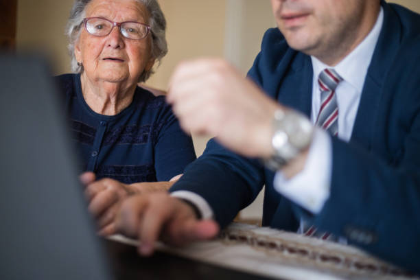 istock Woman looking at laptop her Real Estate Agent is using 1309701500