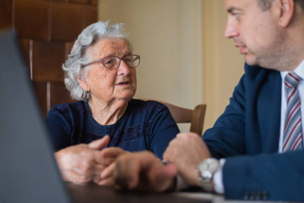 istock Senior woman talking to her laywer 1309701583