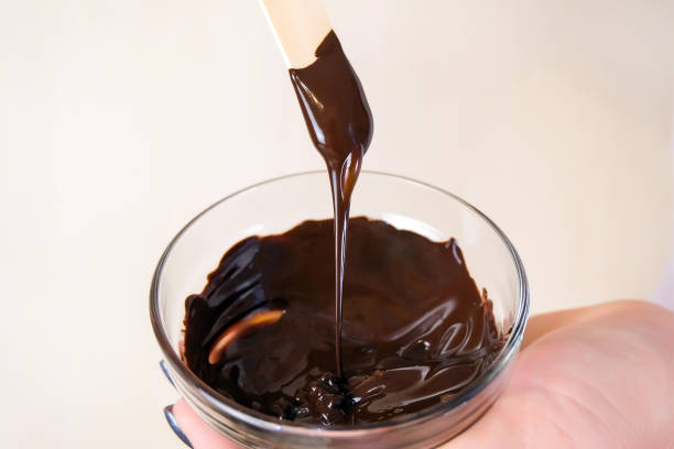 istock Cocoa dark chocolate face and body mask in a bowl. 1309703438