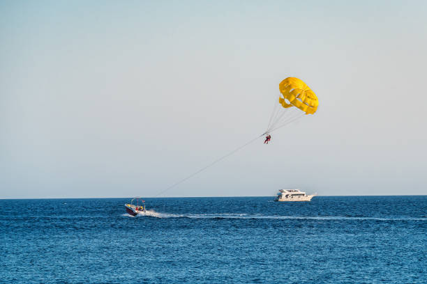 Yellow parasailing over the sea. Vacation theme