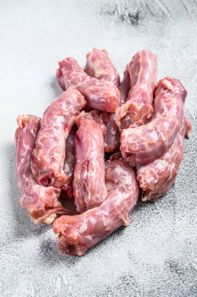 istock Raw fresh chicken neck meat. Gray background. Top view 1309705032