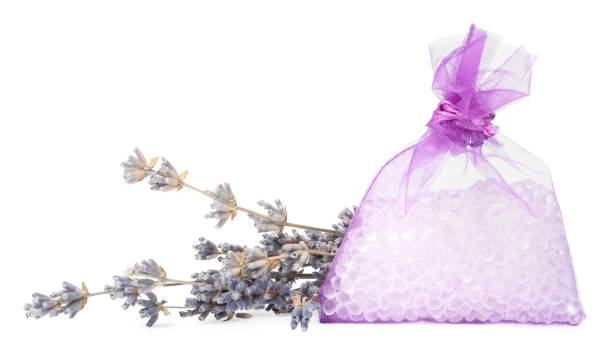 istock Scented sachet with aroma beads and dried lavender on white background 1309705651