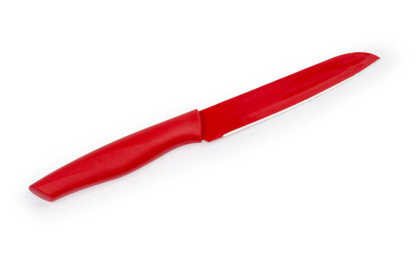 istock Stainless steel multipurpose red kitchen knife on a white background 1309705985