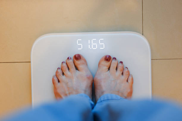 Woman weighing at home
