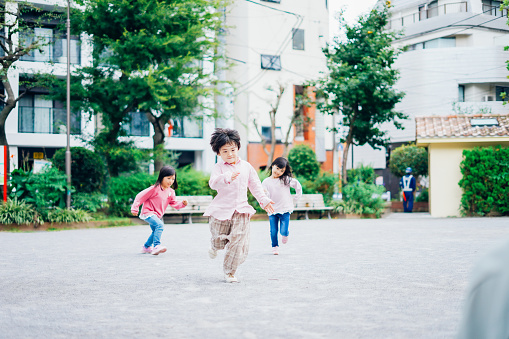Little children running in the park