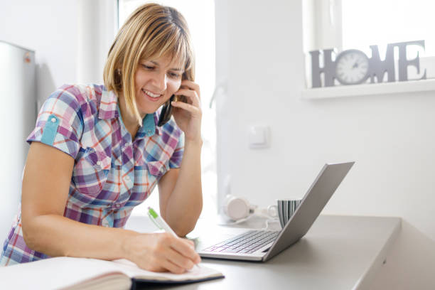 istock Happy business woman having phone conversation 1309707608