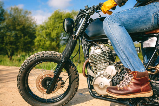 istock Man riding custom motorbike 1309707736