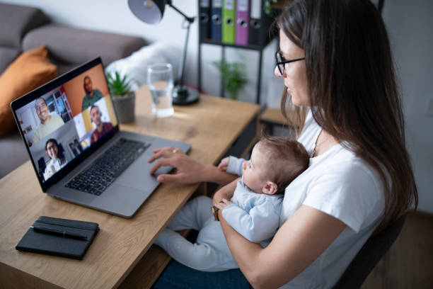 istock A mom trying to work from home while carrying her newborn son. 1309711549
