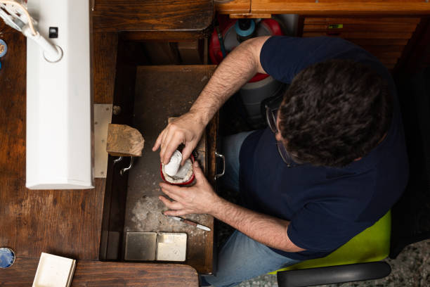 istock goldsmith jeweler prepares silver soldering powder for ring. 1309717986