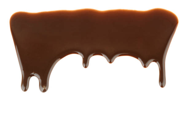 istock Pattern of melted chocolate pouring and dripping on white background 1309720077