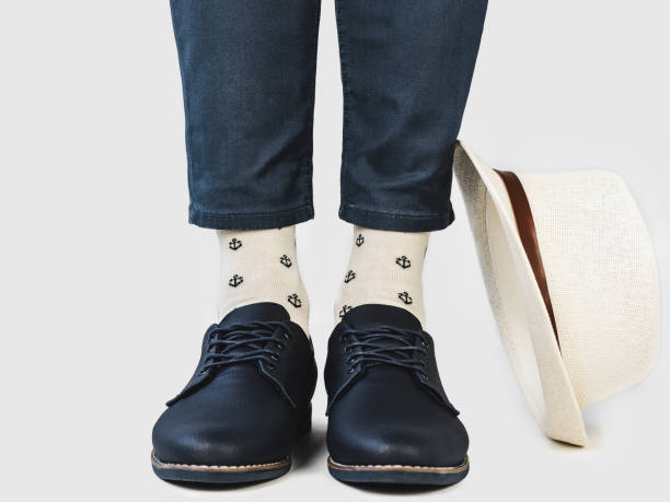 istock Men's legs, trendy shoes and bright socks 1309720617
