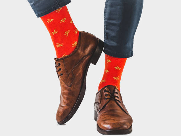 istock Men's legs, trendy shoes and bright socks 1309720670