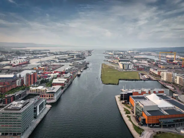View over the City of Belfast - Belfast Harbour along the River Lagan with Sailertown and Titanic Quarter and Titanic Belfast. Aerial Drone Point of View. Belfast, Northern Ireland, UK, Europe