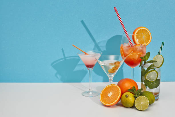 istock Cocktails set. Glasses with various cold  beverages on double white blue background with shadow. Copy space. Cocktail bar 1309722511