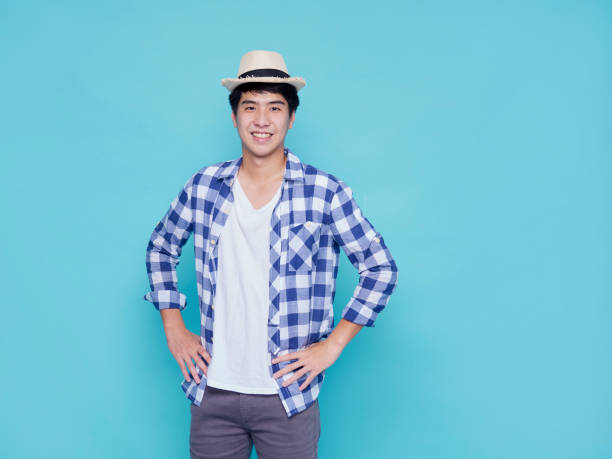 istock Asian handsome man posing on blue background. 1309722564