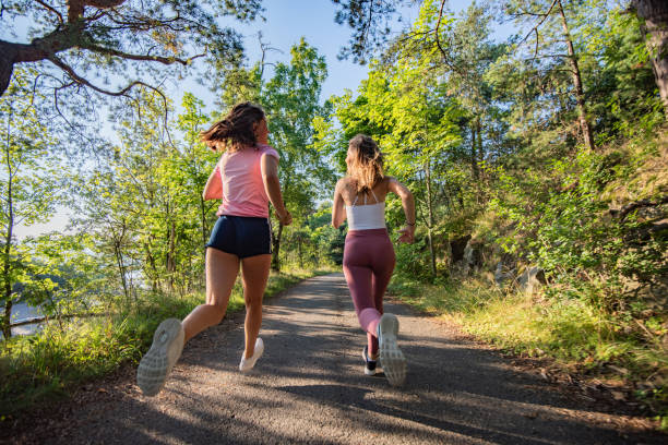 istock Young women jogging outdoors. 1309723077
