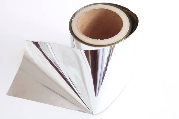 istock Roll of aluminium foil on white background 1309724473