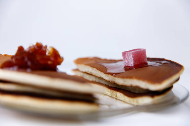 Pancakes with apple jam and Turkish delight on a plate.