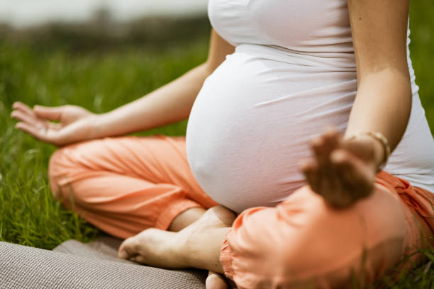 istock Pregnant woman doing yoga 1309726274