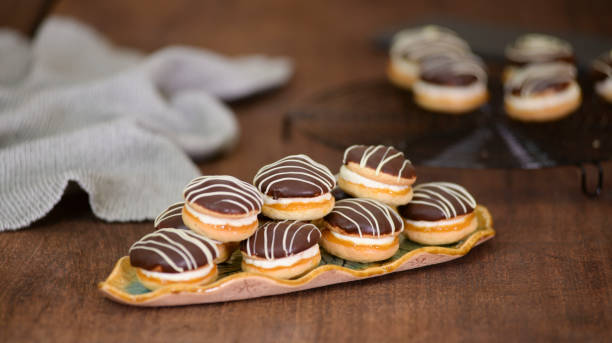 istock Boucher cakes with chocolate icing on a beautiful plate. 1309727575