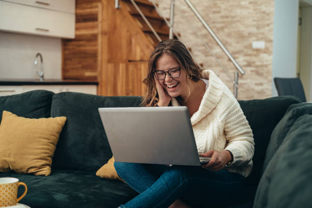 istock Woman using laptop at home for video call 1309731031