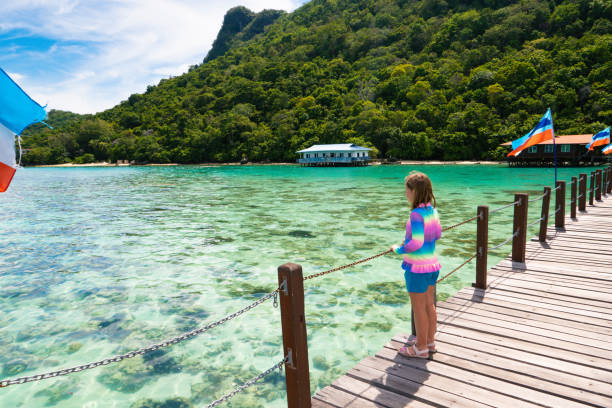istock Kids on tropical beach. Child on resort jetty. 1309731478