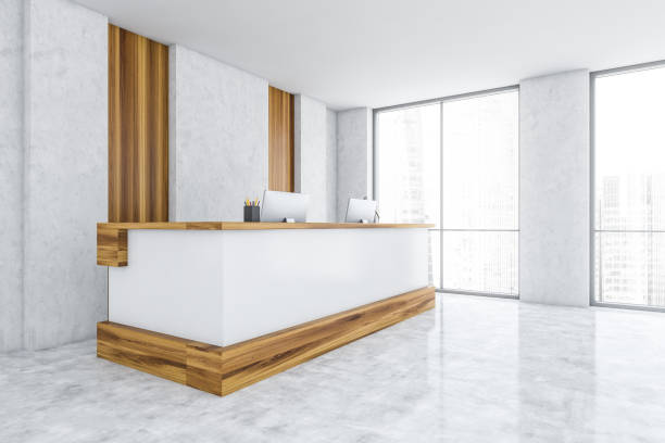 istock White and wooden reception room with computers on marble floor 1309731571