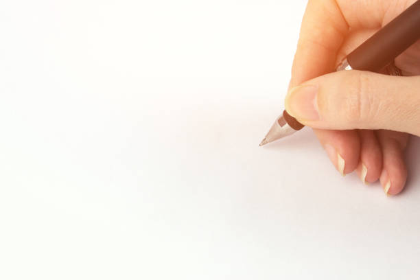 istock Cropped Hand Writing On White Background. Person's Hand Marking On Checklist. 1309732503
