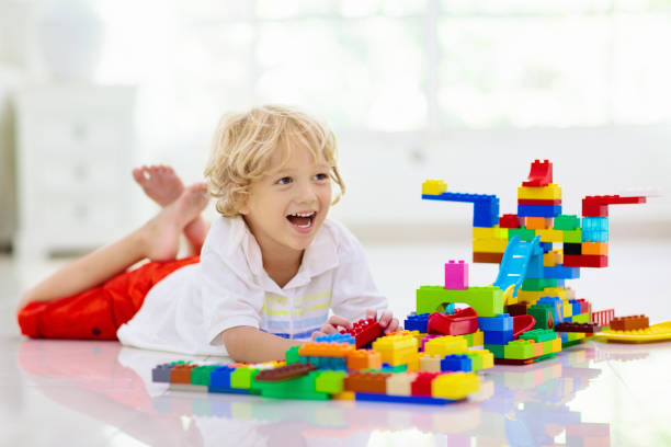 istock Child playing with toy blocks. Kids play. 1309733269