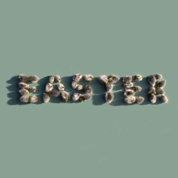 istock Easter inscription from spring willow catkins on a mint background. Happy easter creative greeting card. 1309733533