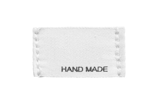 Clothing label sayt hand made isolated over white