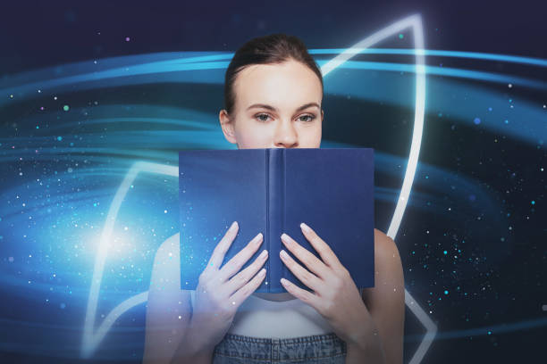 istock Woman with book and start up sign 1309735055