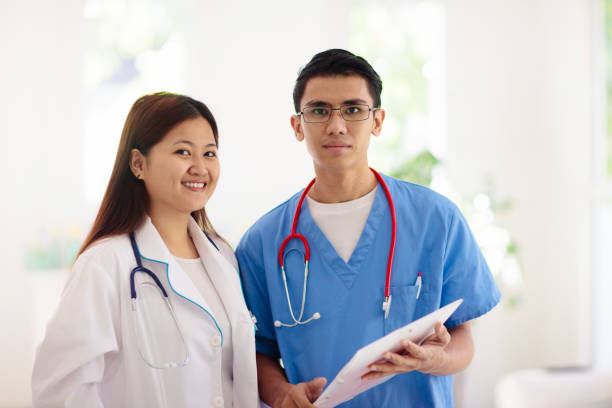 istock Doctor or nurse with stethoscope and face mask. 1309736048