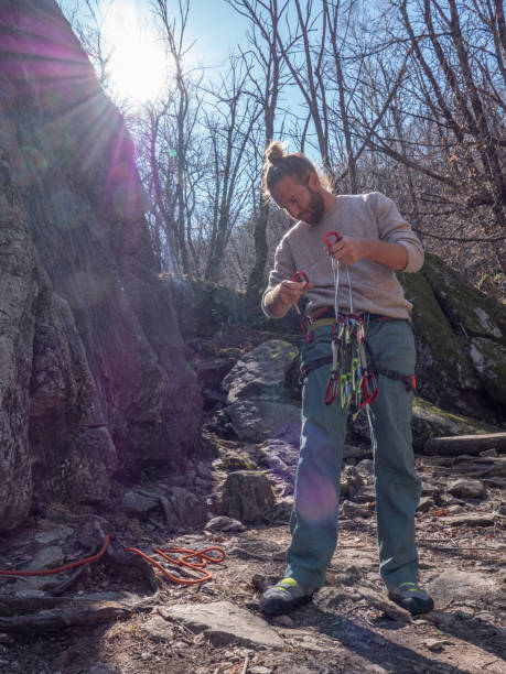 istock Mountain climber prepares to ascend rock face 1309737134