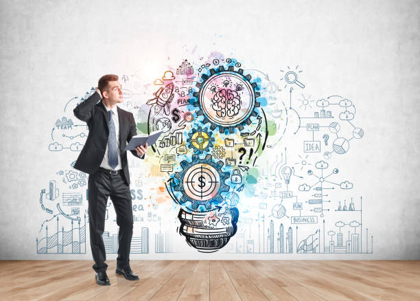 istock Pensive man with notebook, business idea 1309737160