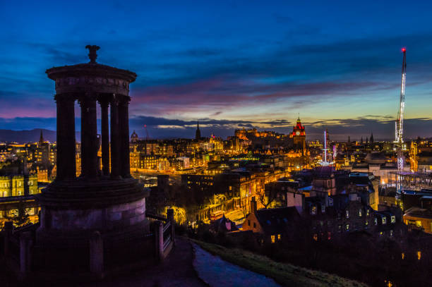 Sunset from Calton Hill with the Edinburgh castle in Edinburgh Scotland UK stock photo