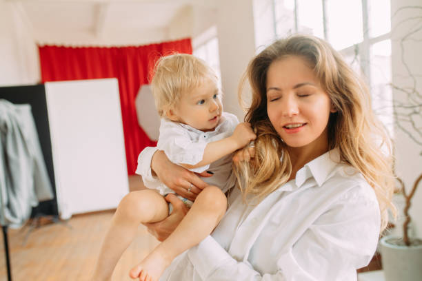 istock Happy mother plays with her little son. 1309738519