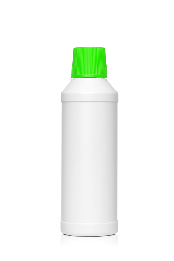 Small white plastic bottle with green screw cap and copy space. \nimage contains a clipping path