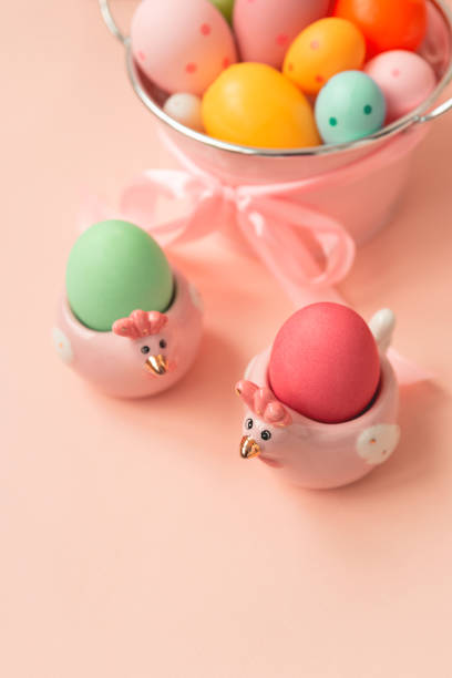 istock Easter eggs and ceramic hen on pink wooden table. Easter celebration concept. Soft focus. Copy space 1309739952