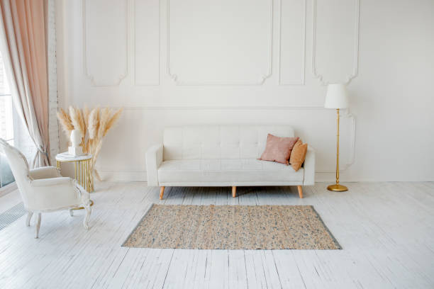 istock Stylish Scandinavian modern white cozy eco interior in minimalist style. Modern home decor with Pampas grass in vase. Open space. Monochrome, copy space 1309740295