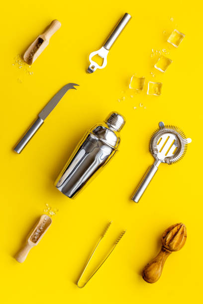 istock Set of cocktail drink tools and ingredients with shaker and ice. Flat lay 1309743426