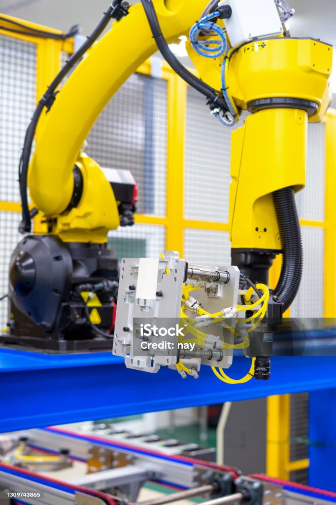 Inspection unit on industrial robot arm in automative manufacture plant Robot with Vision system in windshield sealing apply of automotive assembly line Production Line Stock Photo