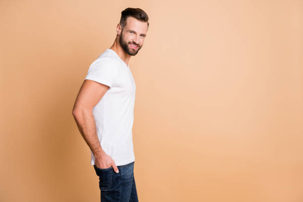 istock Profile side view portrait of content attractive cheerful guy going copy space ad isolated over beige pastel color background 1309745599