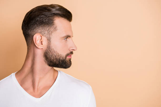 istock Profile side photo of young handsome bristle man confident look empty space isolated over beige color background 1309745680