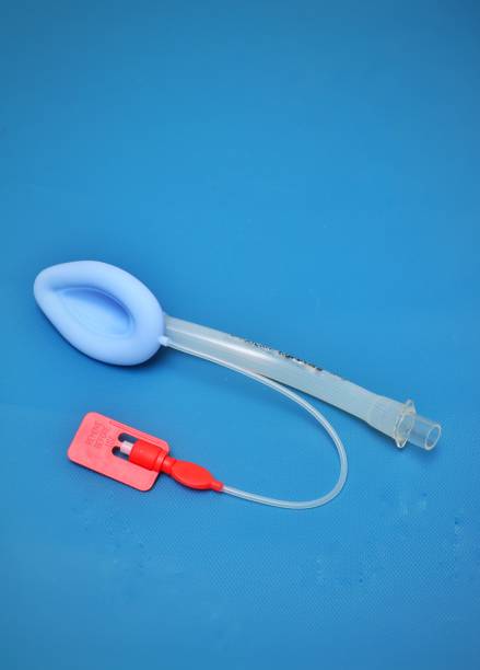laryngeal airway mask (lma) on a blue background - lifeguard association imagens e fotografias de stock