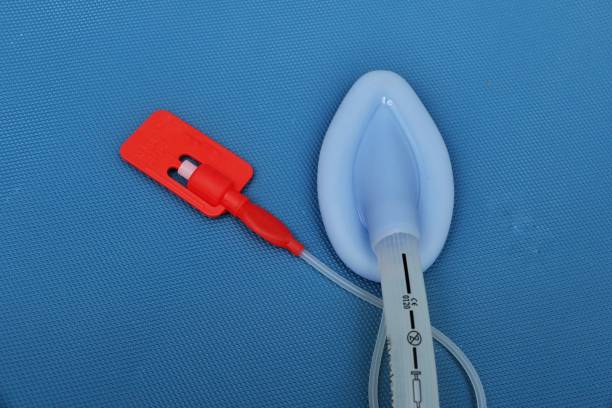 laryngeal airway mask (lma) on a blue background - lifeguard association imagens e fotografias de stock