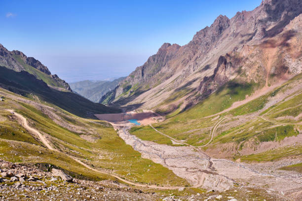 istock Protection Dam Mud Danger Mountains Blue Sky 1309747359